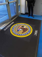 Custom Made Logo Mat Purchased On GSA Contract - Department Of Justice Metropolitan Detention Center Brooklyn New York
